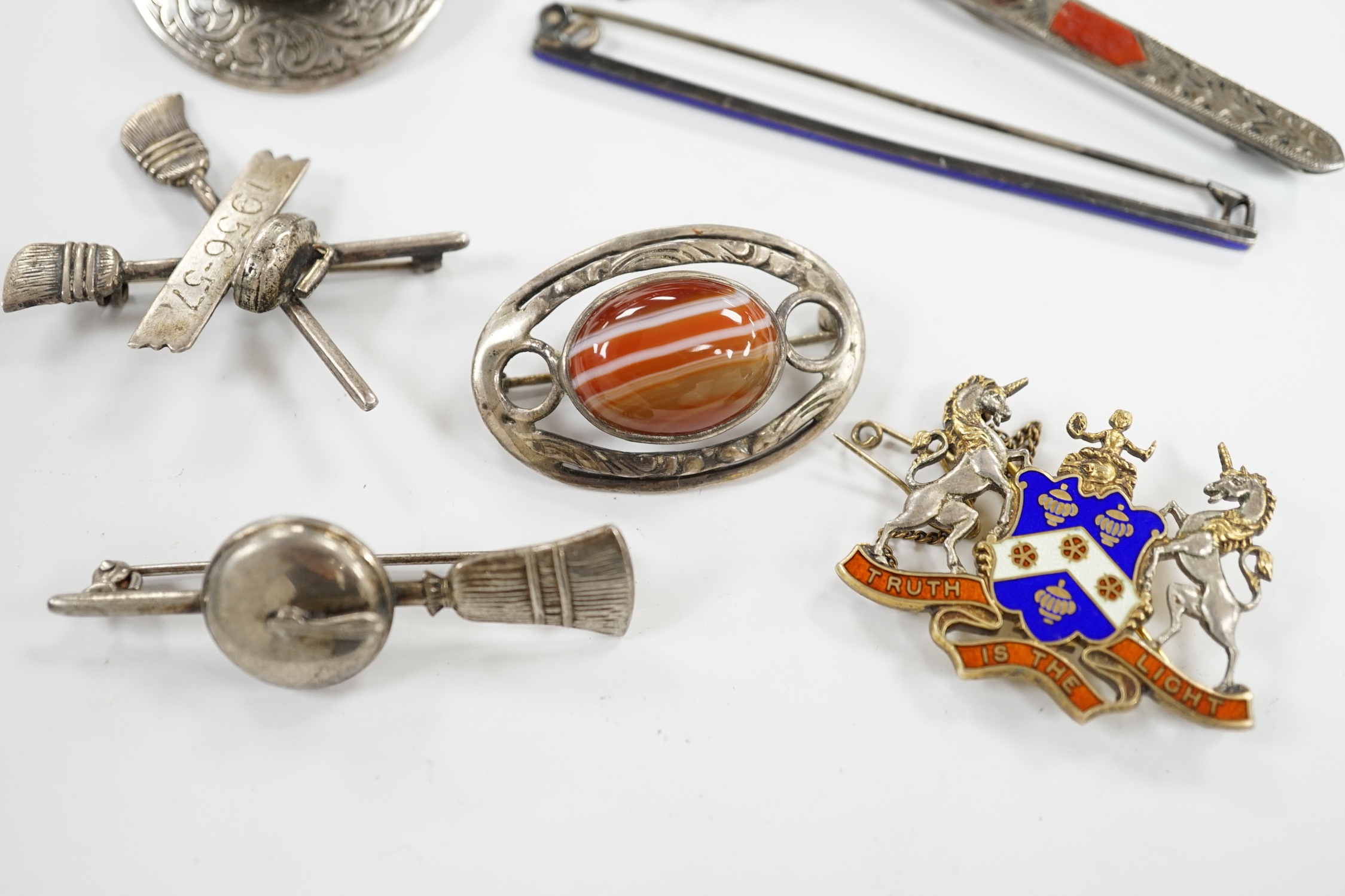 A 1950's Scottish silver, gem and Scottish hardstone set brooch, 91mm, together with six other brooches including four sterling and one silver. Condition - fair